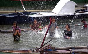 Kids in the Rain in Labuan Bajo Harbour 